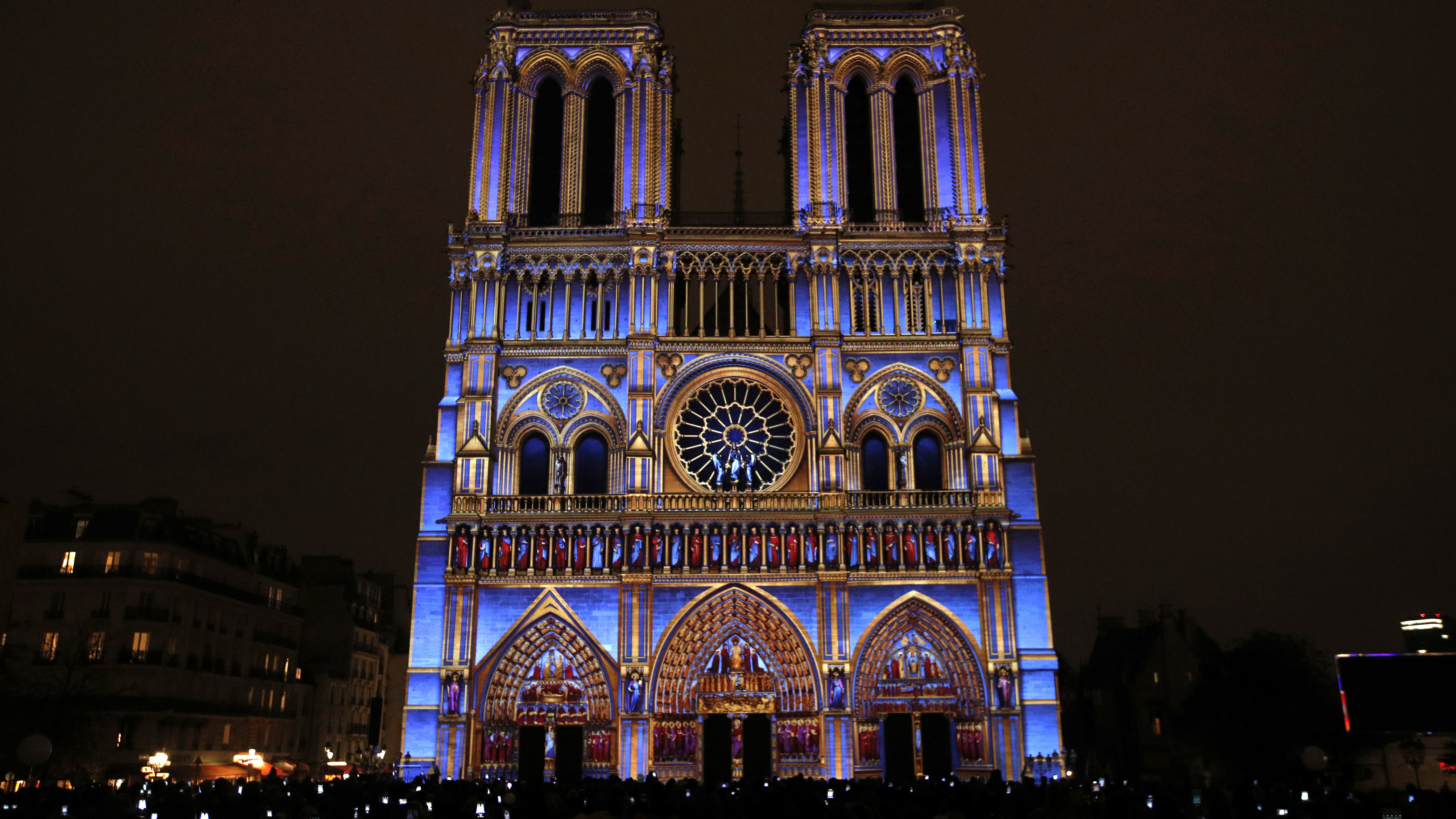 Spectacular Light Show At Notre Dame Cathedral Commemorates World