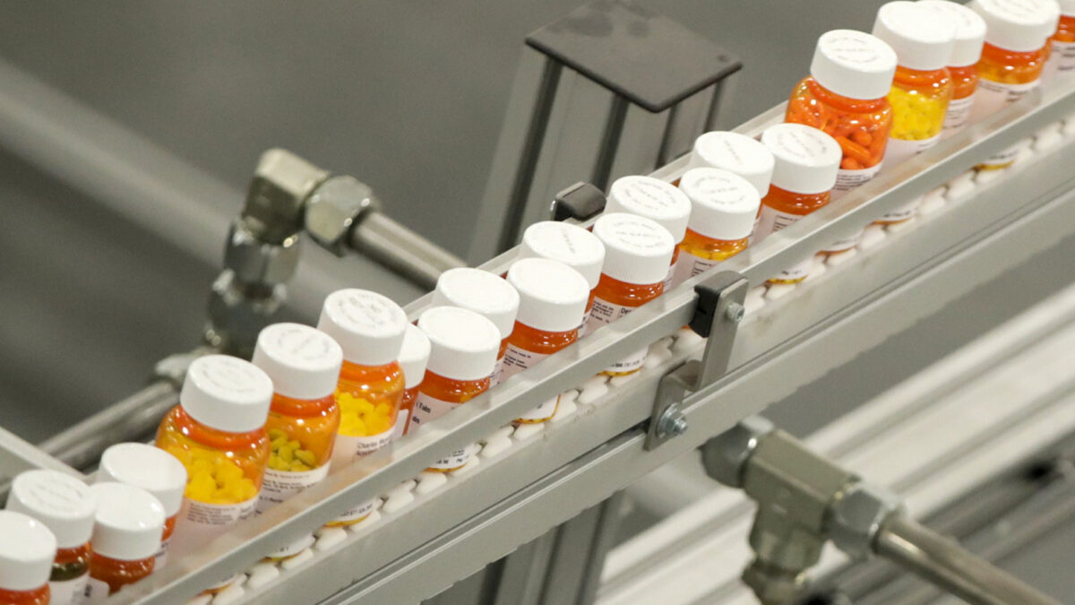 Bottles of medicine ride on a belt at a mail-in pharmacy warehouse in Florence, N.J. Millions of older Americans take medications daily that may not still be necessary or beneficial to their health. Doctors are raising awareness about 